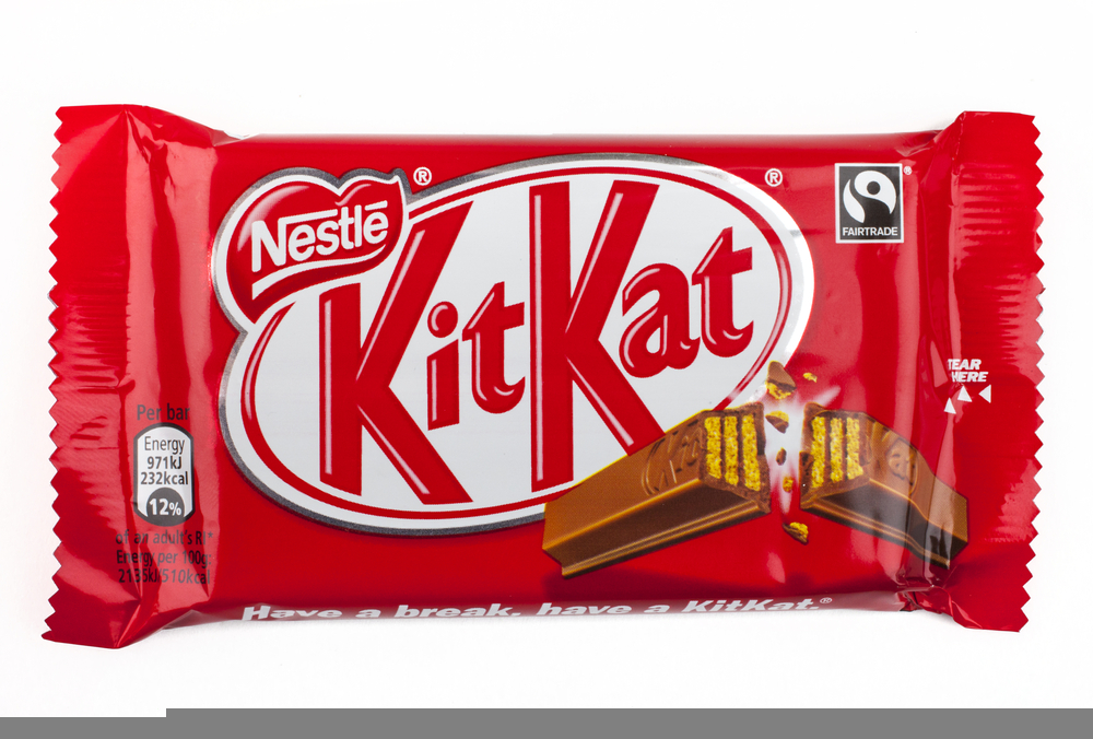 An unopened Kit Kat chocolate bar manufactured by Nestle, pictured over a plain white background on 6th May 2016.