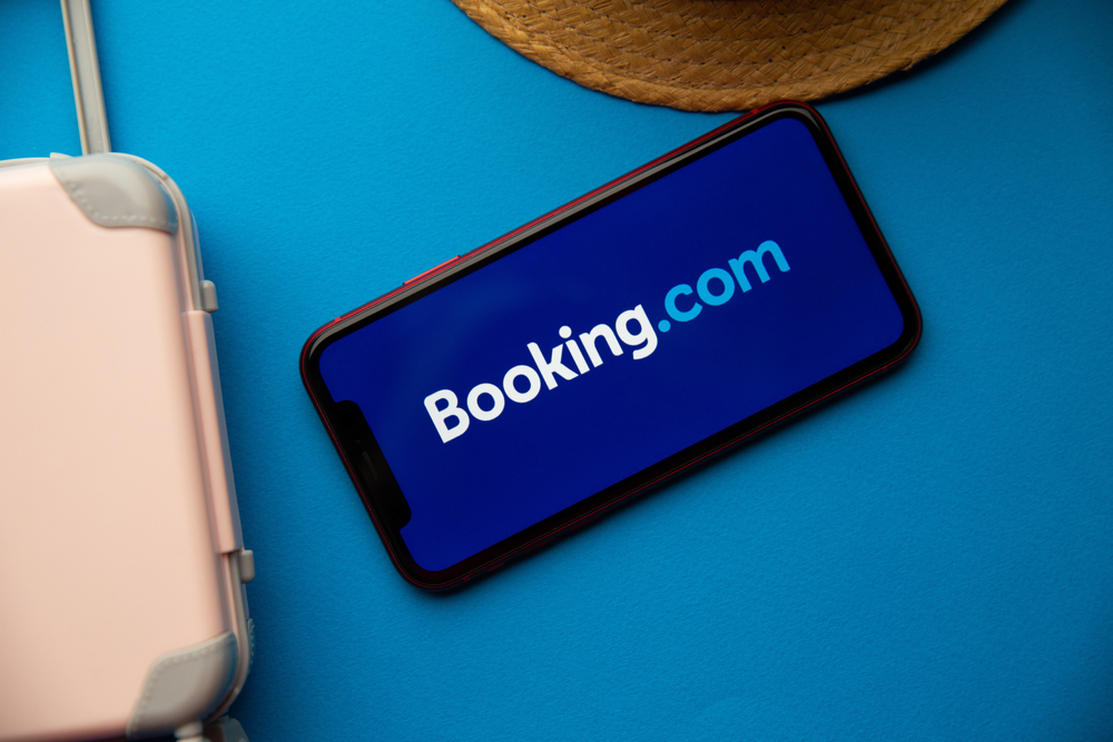 Booking.com app logo on iPhone display