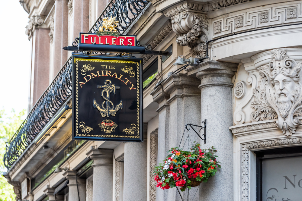 Closeup of famous Admiralty pub bar with entrance and nobody red Fuller's sign by Trafalgar Square
