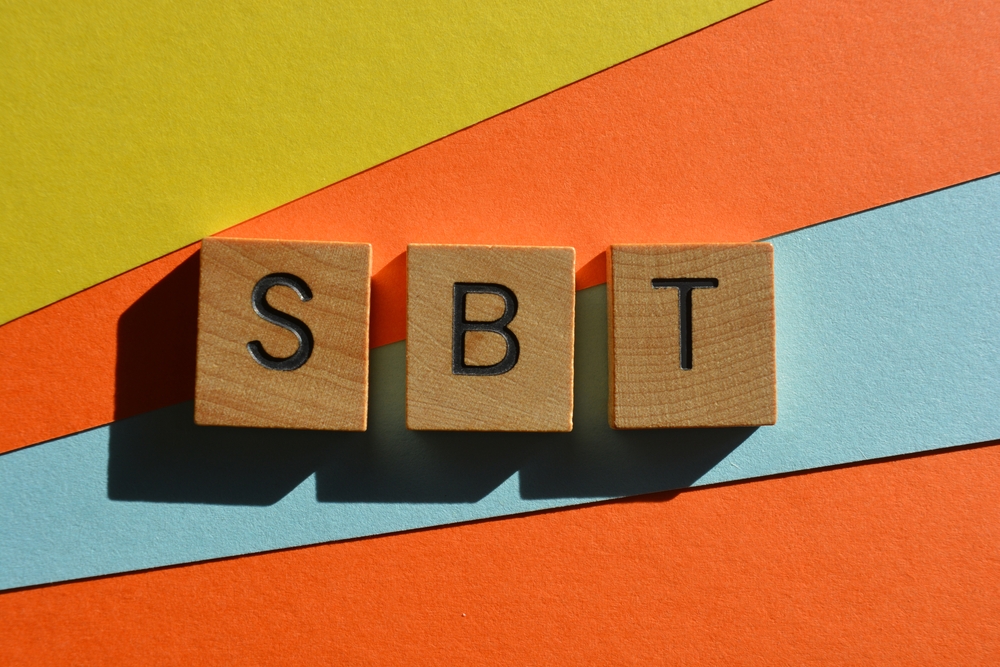 SBT, acronym for Science-Based Targets in wooden alphabet letters isolated on multicolored background