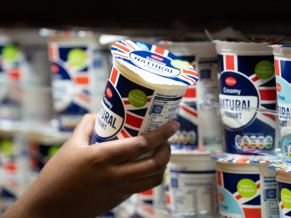 Customer holding Lidl yoghurt